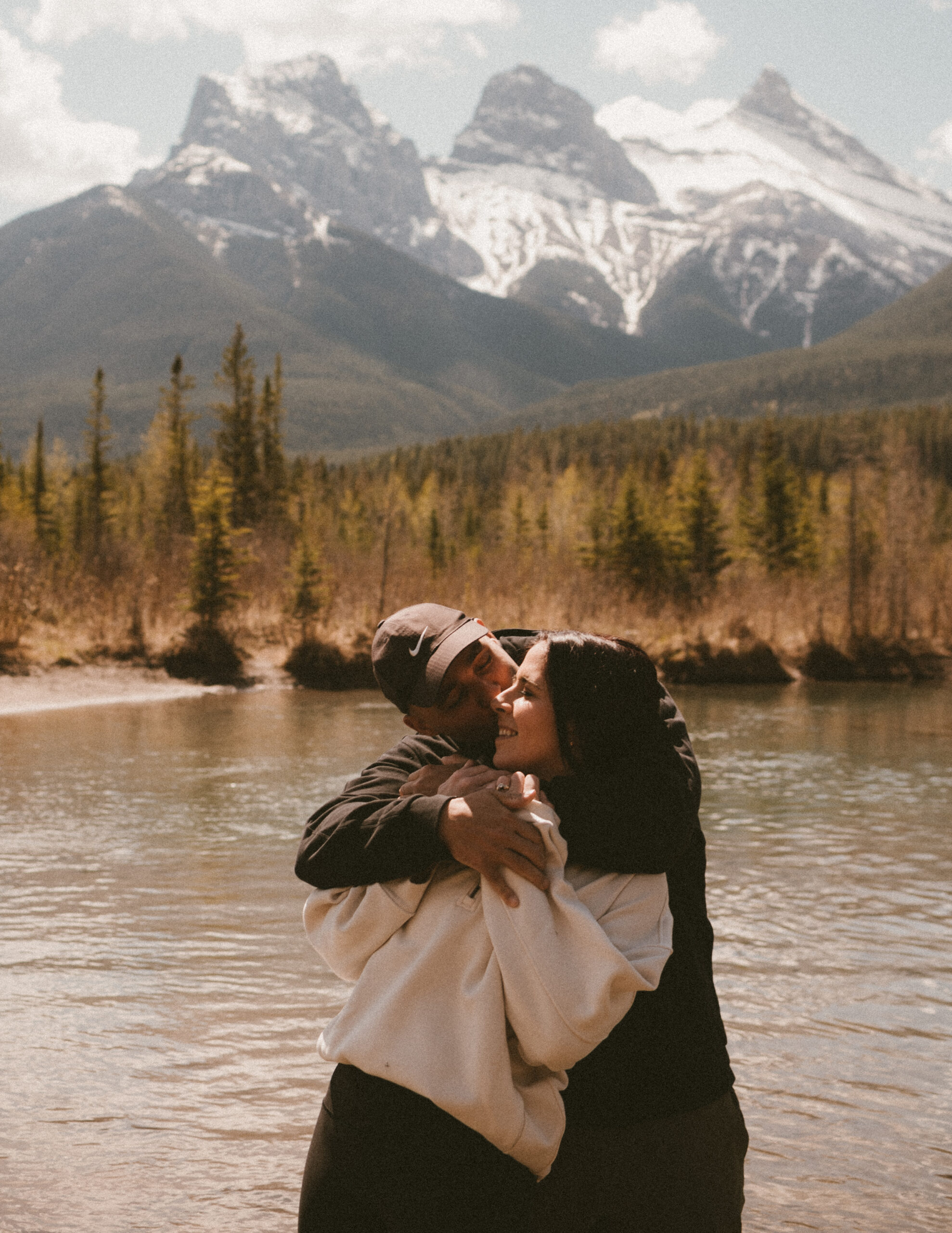 Romantic couple at Three Sisters Viewpoint in Canmore, Alberta